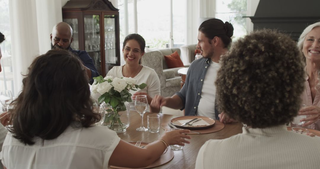 Diverse Group Socializing at Dinner Table Celebration