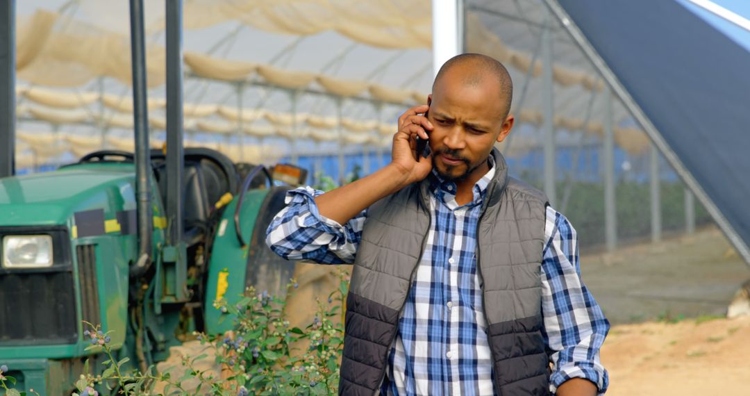 African American Farmer Using Smartphone on Farm - Free Images, Stock Photos and Pictures on Pikwizard.com