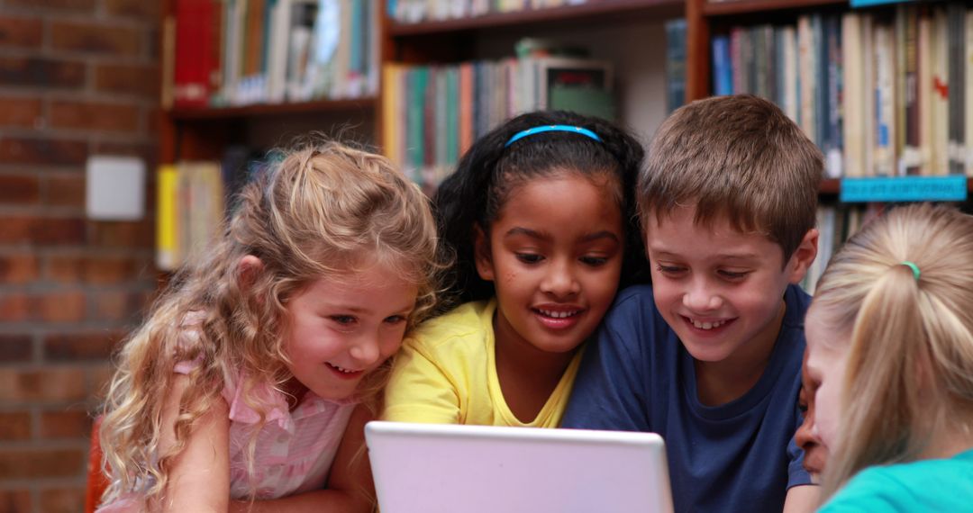 Diverse Group of Children Using Laptop in Library - Free Images, Stock Photos and Pictures on Pikwizard.com