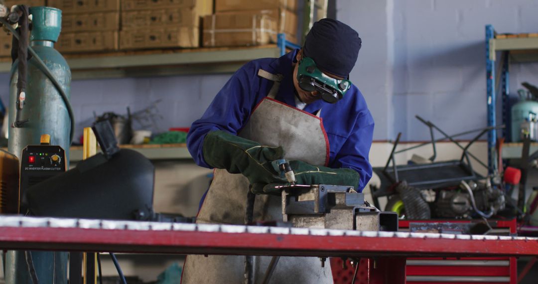 Industrial Worker Wearing Safety Gear Welding Metal Object in Workshop - Free Images, Stock Photos and Pictures on Pikwizard.com