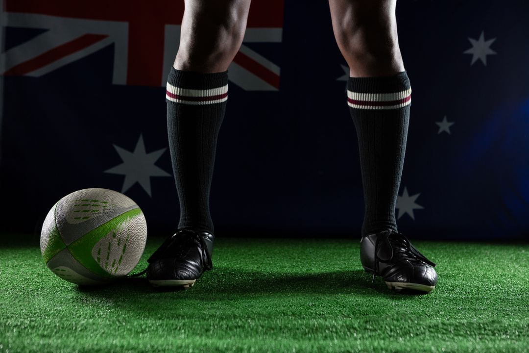 Low section of rugby player standing against Australian flag - Free Images, Stock Photos and Pictures on Pikwizard.com