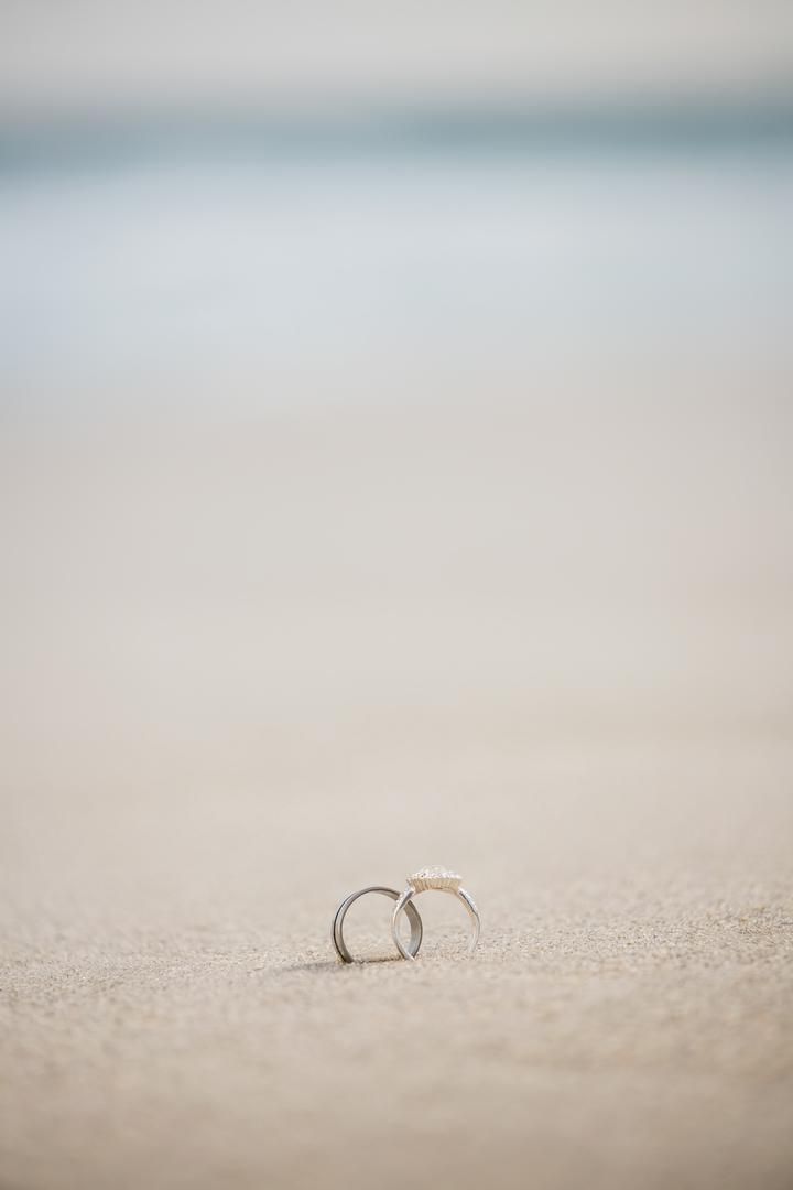 Romantic Wedding Rings in Sand on Beach - Free Images, Stock Photos and Pictures on Pikwizard.com