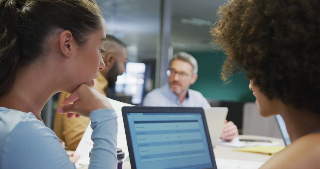 Diverse Team Sharing Ideas During Business Meeting
