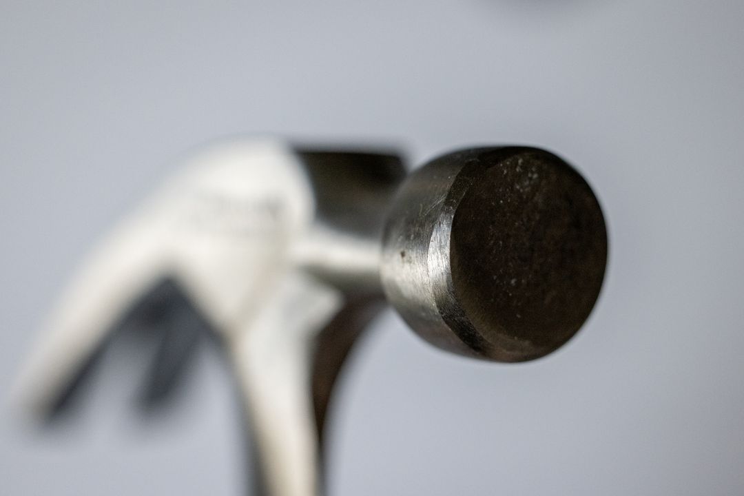 Close-Up of Hammer Head Against Soft Background