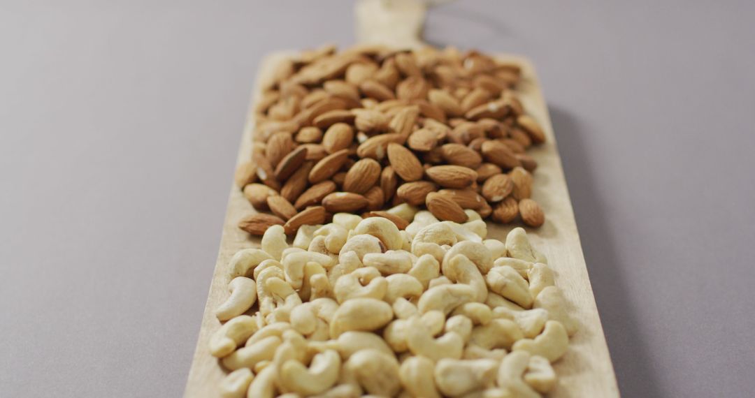 Assorted Nuts on Rustic Wooden Chopping Board for Healthy Living