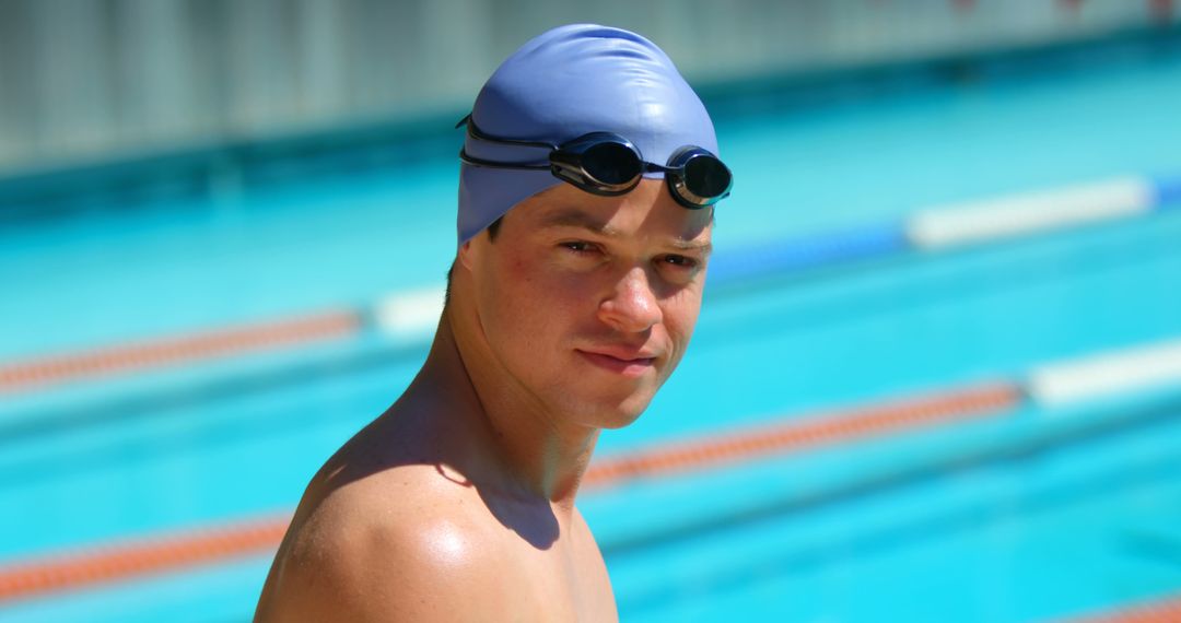 Serious Young Swimmer Wearing Swim Cap and Goggles by the Pool - Free Images, Stock Photos and Pictures on Pikwizard.com