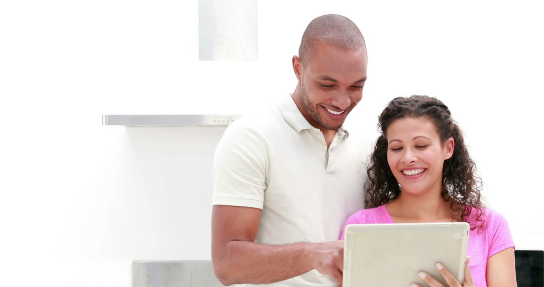Cheerful Couple Enjoying Browsing Together with Tablet