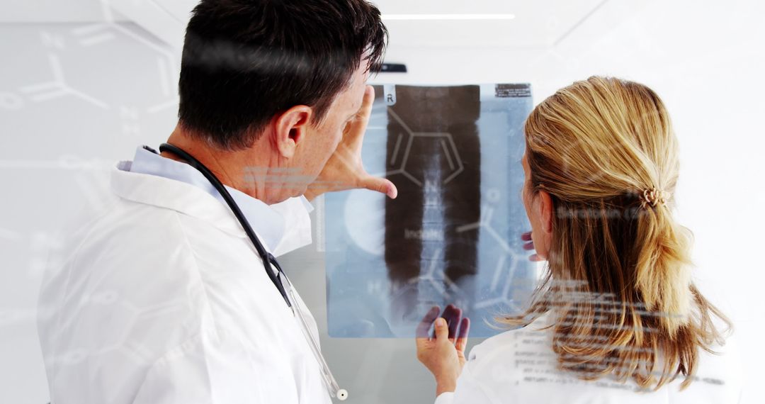 Doctors Analyzing X-Ray with Futuristic Technology Overlay