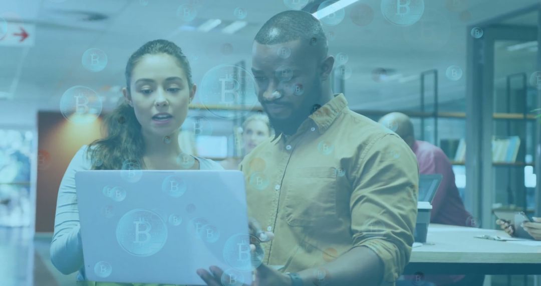 Diverse Team Analyzing Cryptocurrency in Modern Office