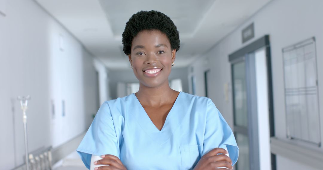 African American Nurse Smiling in Hospital Corridor - Free Images, Stock Photos and Pictures on Pikwizard.com