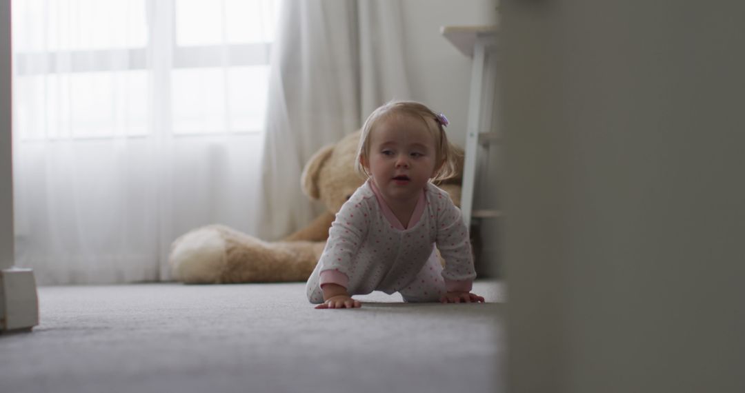 Caucasian baby crawling on the floor at home - Free Images, Stock Photos and Pictures on Pikwizard.com