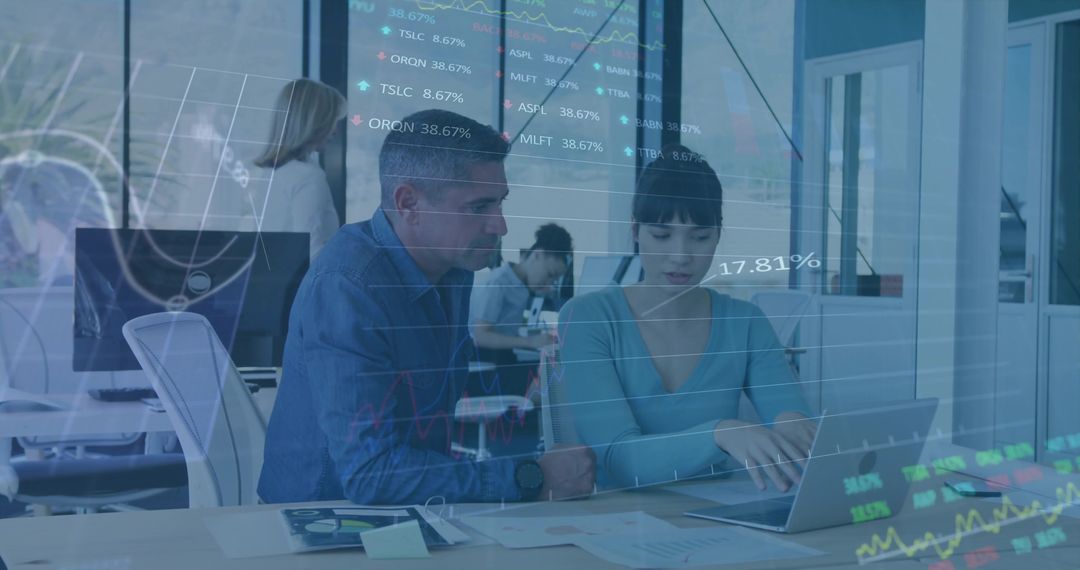 Business Team Analyzing Financial Data in Modern Open-Plan Office