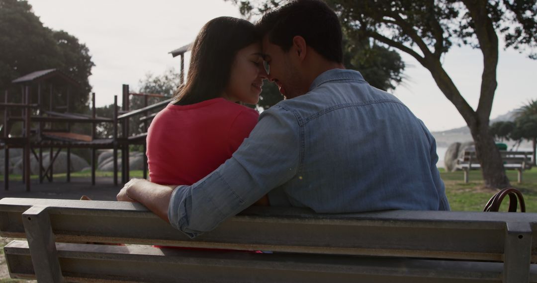 Happy Couple Embracing on a Park Bench