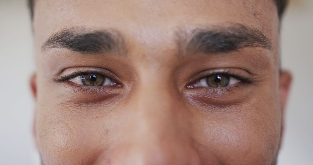 Close-up of Smiling Man's Eyes Expressing Joy and Warmth - Free Images, Stock Photos and Pictures on Pikwizard.com