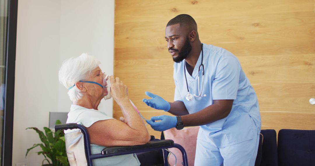 Nurse Assisting Elderly Patient with Oxygen Therapy - Free Images, Stock Photos and Pictures on Pikwizard.com