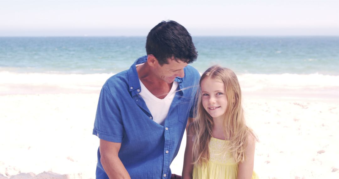 Father and Daughter Enjoying Sunny Beach Day - Free Images, Stock Photos and Pictures on Pikwizard.com