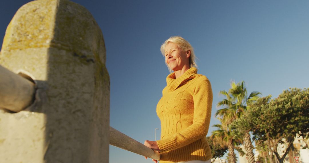 Senior Woman Enjoying Outdoor Morning Walk at Beachfront - Free Images, Stock Photos and Pictures on Pikwizard.com