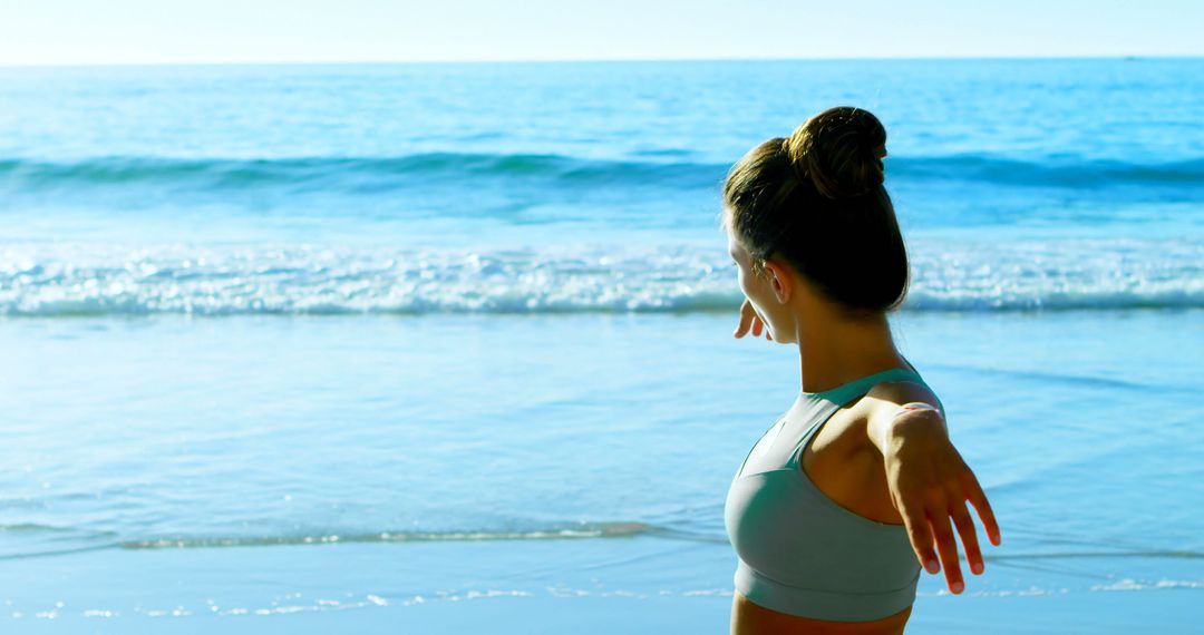 Woman Stretching Arms on Beach with Ocean View - Free Images, Stock Photos and Pictures on Pikwizard.com