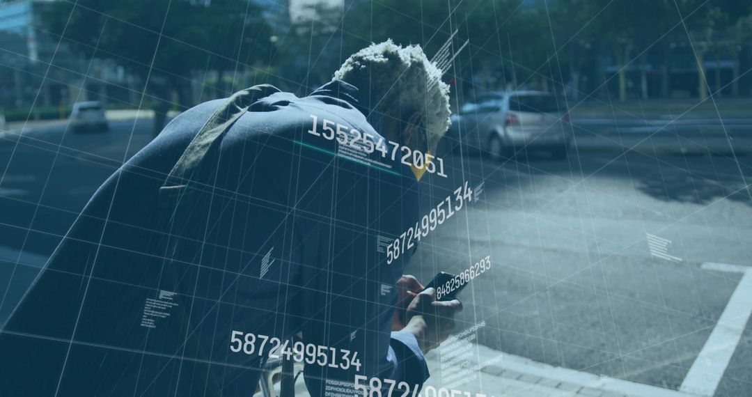 Urban Connectivity: Man Engaged with Smartphone Data at Crosswalk