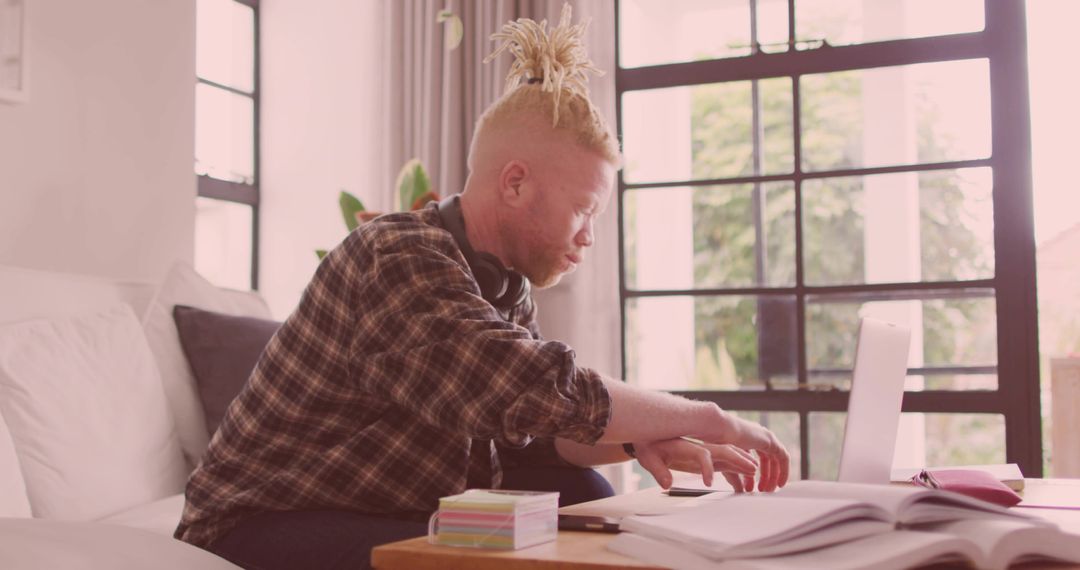 Student Focusing on Studies in Cozy Living Room Setting