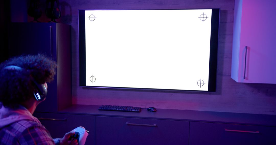 Gamer immerses in digital adventure using controller and headphones