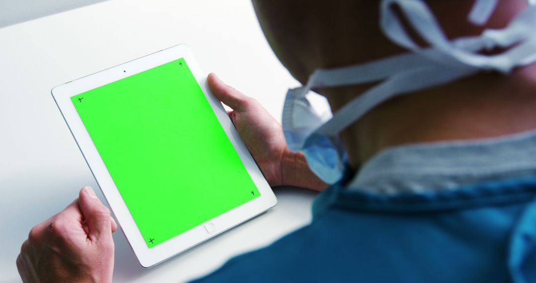 Doctor Holding Tablet with Green Screen for Medical Applications - Free Images, Stock Photos and Pictures on Pikwizard.com