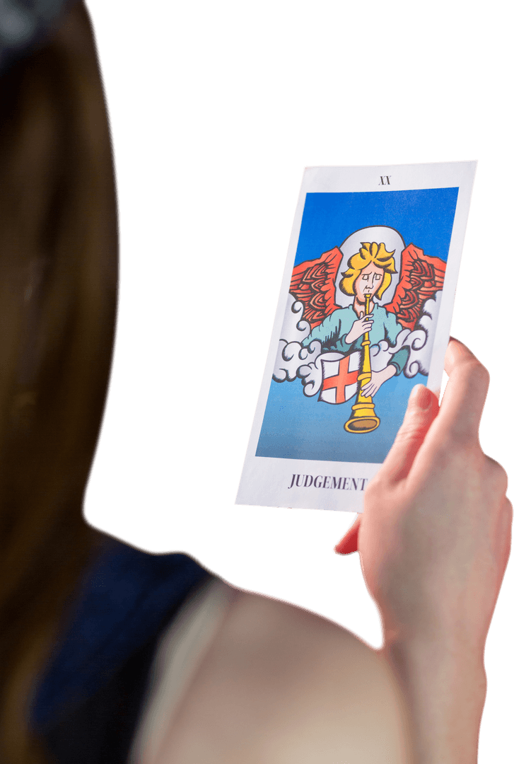 Hand Holding Transparent Tarot Card Featuring Angel Illustration