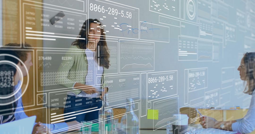 Diverse Team Engaging in Futuristic Data Analysis in Office