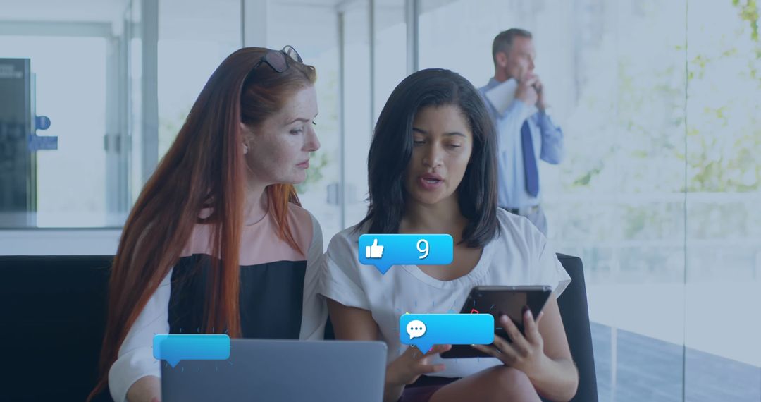 Diverse Women Engaging with Social Media Reviews on Tablet in Modern Office