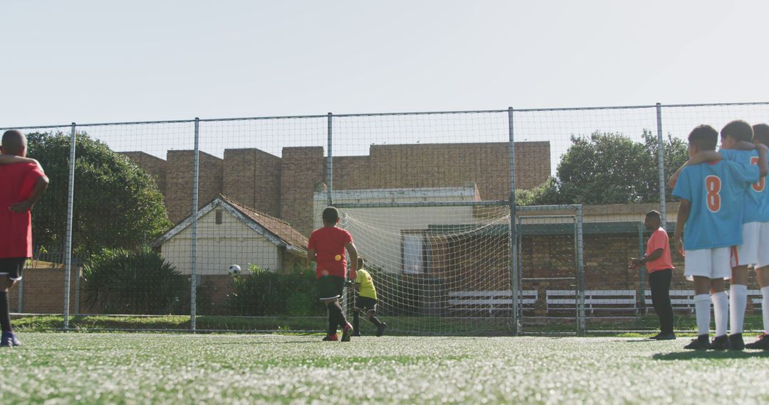 Youth soccer team preparing for penalty kick during a match - Free Images, Stock Photos and Pictures on Pikwizard.com