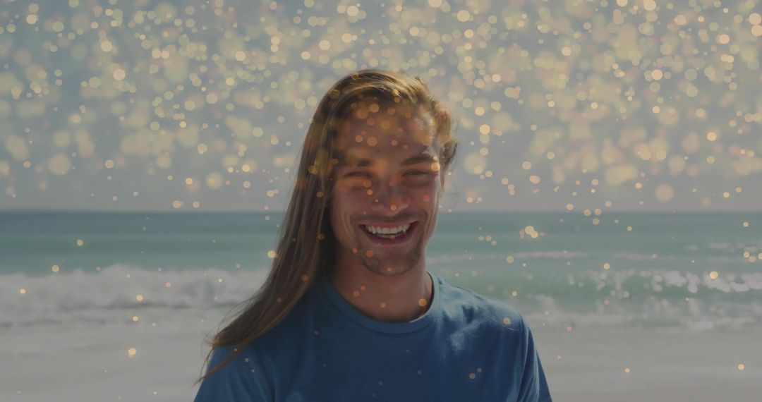 Smiling Man on Sunny Beach with Golden Bokeh