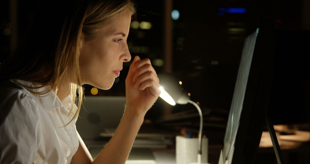 Young woman working late at night on a computer - Free Images, Stock Photos and Pictures on Pikwizard.com