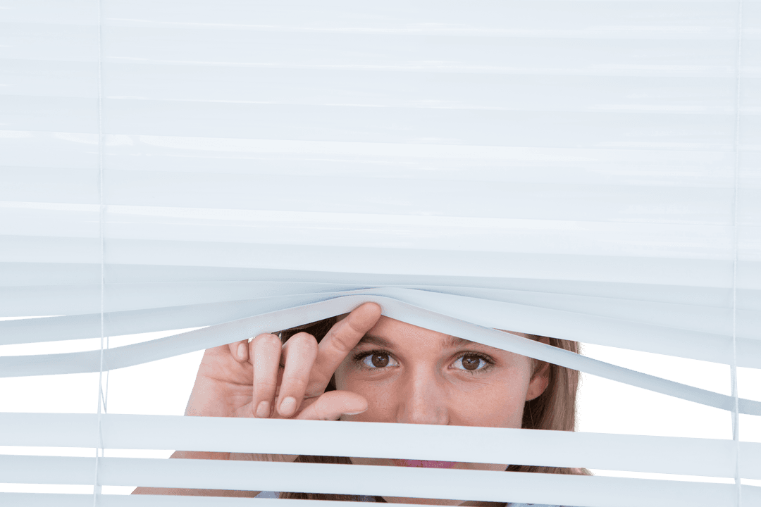 Curious Woman Peering Through Transparent Blinds