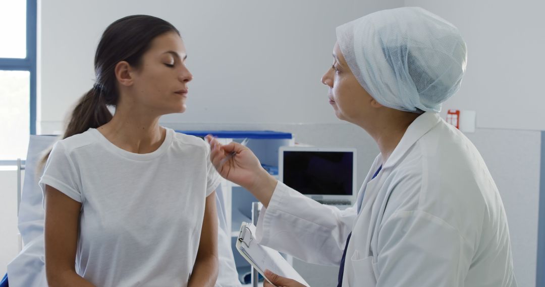 Doctor Examining Female Patient in Hospital Room - Free Images, Stock Photos and Pictures on Pikwizard.com