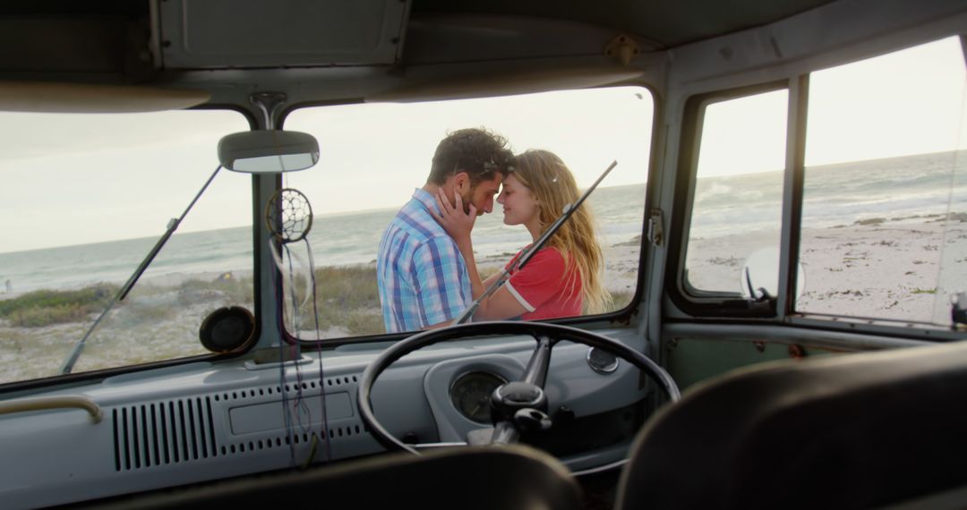 Romantic Couple Embracing by Beach Viewed from Inside Vintage Van - Free Images, Stock Photos and Pictures on Pikwizard.com