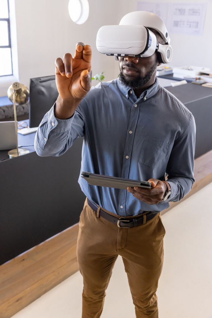 Businessman Using VR Headset with Tablet in Modern Office