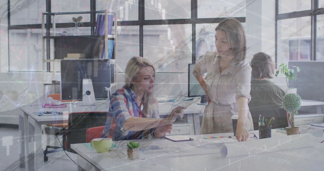 Diverse Colleagues Collaborating in Modern Office with Financial Data Overlay