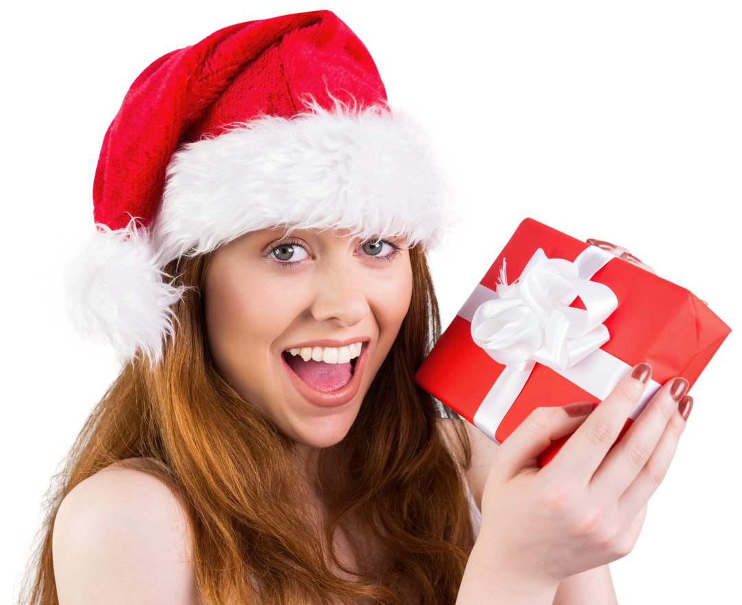 Festive Redhead Wearing Santa Hat Holding Gift with Joyful Expression Transparent - Download Free Stock Images Pikwizard.com