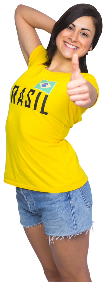 Confident Female Brazil Fan in Yellow T-Shirt Shows Thumbs Up - Download Free Stock Images Pikwizard.com