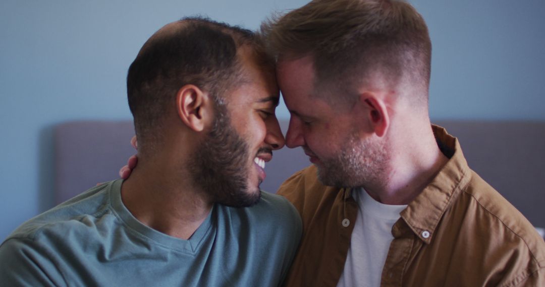 Multi ethnic gay male couple embracing and smiling - Free Images, Stock Photos and Pictures on Pikwizard.com