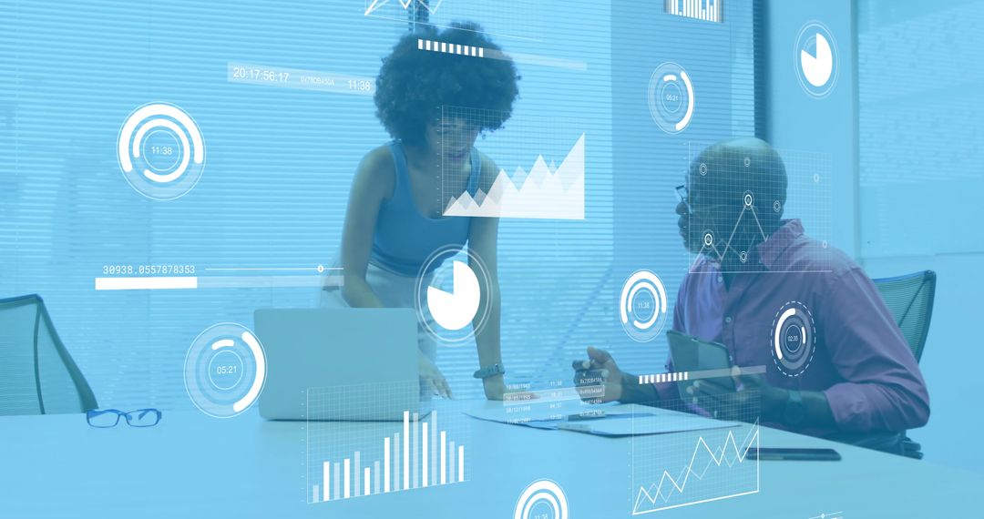 Colleagues Analyze Digital Financial Data in Modern Office Setting