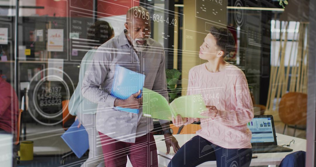 Diverse Team Brainstorming in Modern Workspace with Technology Focus