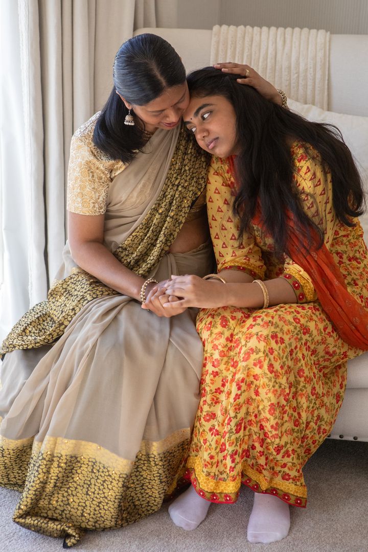 Indian Mother and Daughter Expressing Bonding in Traditional Attire