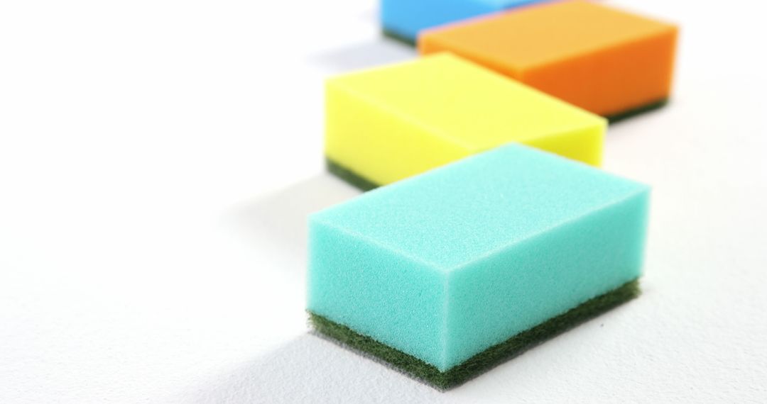 Colorful Household Sponges in Row with White Background - Free Images, Stock Photos and Pictures on Pikwizard.com