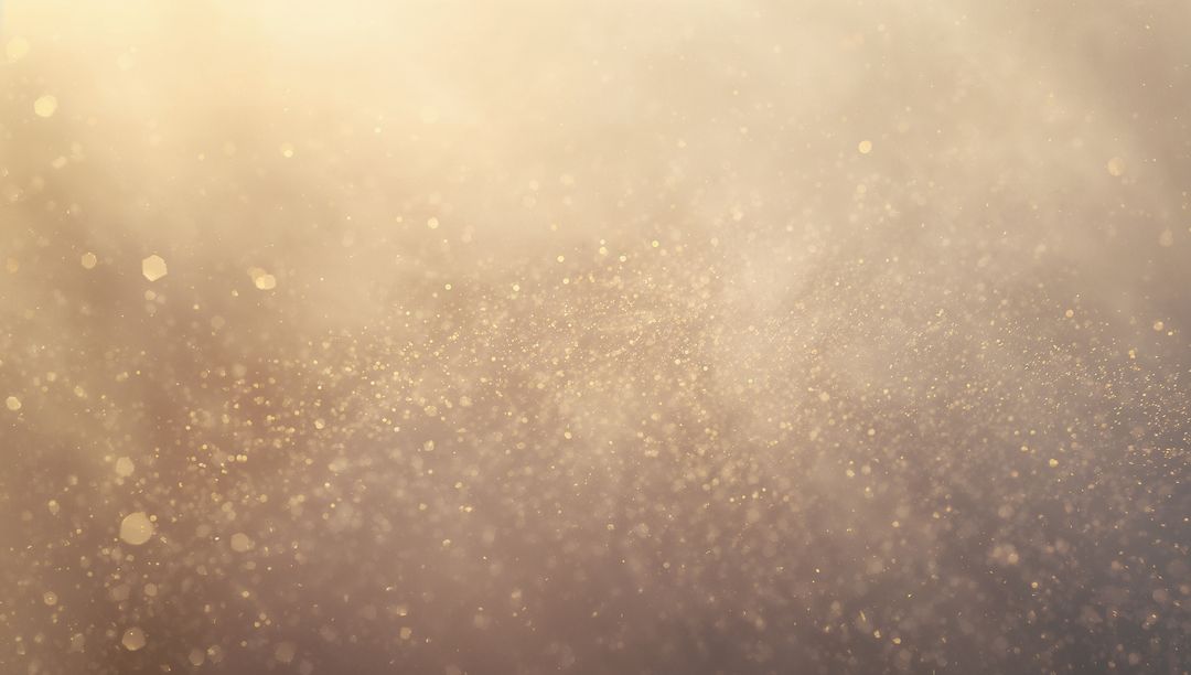 Golden dust particles drifting with soft bokeh, shimmering glow, ethereal sparkle