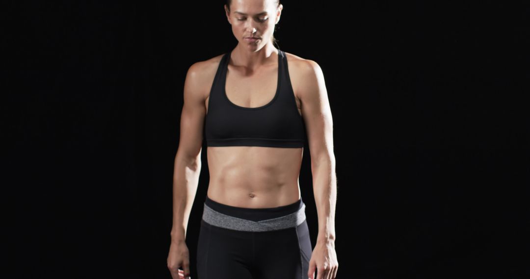 Athletic Woman Focusing Before Workout in Studio