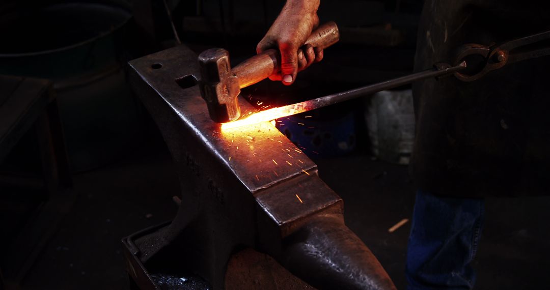Blacksmith Crafting Metal on Anvil in Workshop with Hammer
