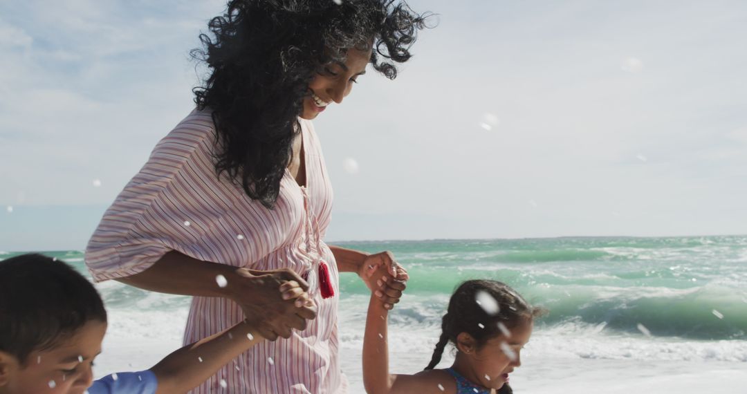 Mother Enjoying Moment with Children on Ocean's Edge