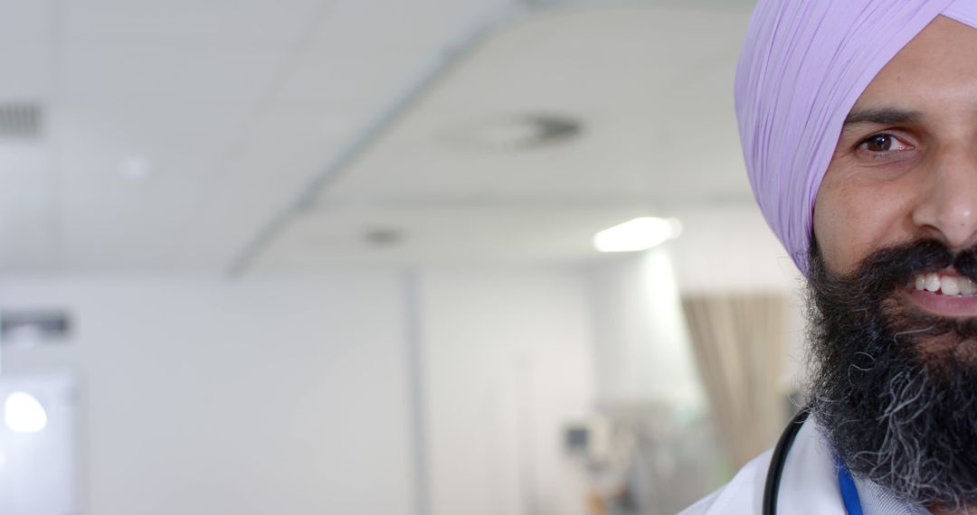 Smiling Sikh Doctor Standing in Hospital Corridor - Free Images, Stock Photos and Pictures on Pikwizard.com