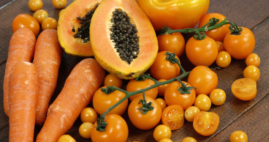 Assortment of Fresh Orange Vegetables and Fruits on Wooden Surface - Free Images, Stock Photos and Pictures on Pikwizard.com